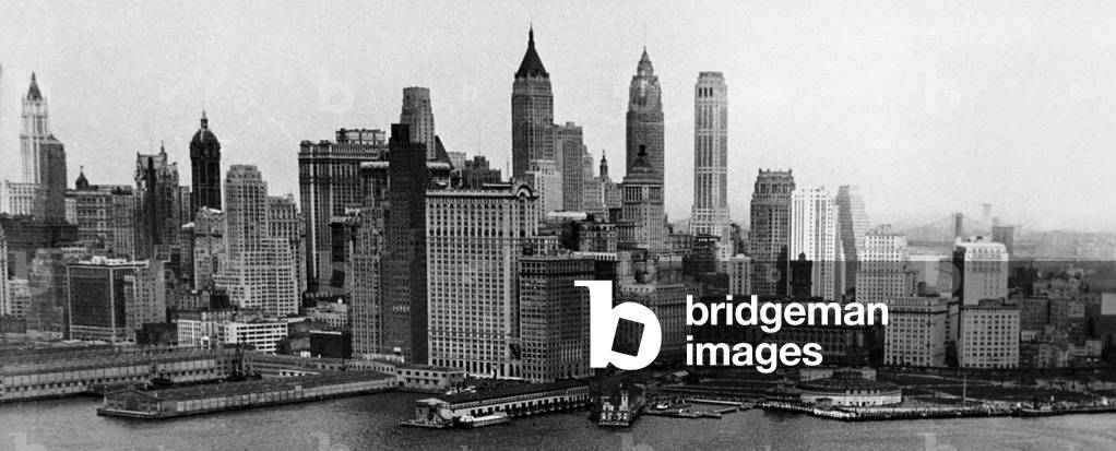 View of Lower Manhattan, New York c. 1947. On l : WoolWorth Building, c (background) : 40 Wall Street, American International Building and One Wall Street. Foreground in c : Whitehall Building