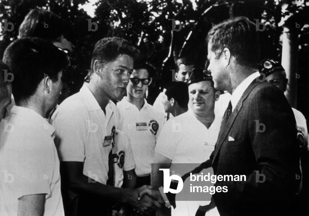 Young Bill Clinton shaking hands to President John F Kennedy in 1963 during reception at the White House in Washington