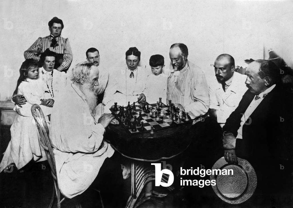 Russian writer playing chess c. 1905 : l-r : Tania Tolstoi on kneel of her aunt Tatiana Soukhotine Tolstoi, Miss Igoumnoff, Leon Tolstoi, ?, Sophie Tolstoi, Jean Tolstoi, Mr Soukhotine, Michel Tolstoi, ?