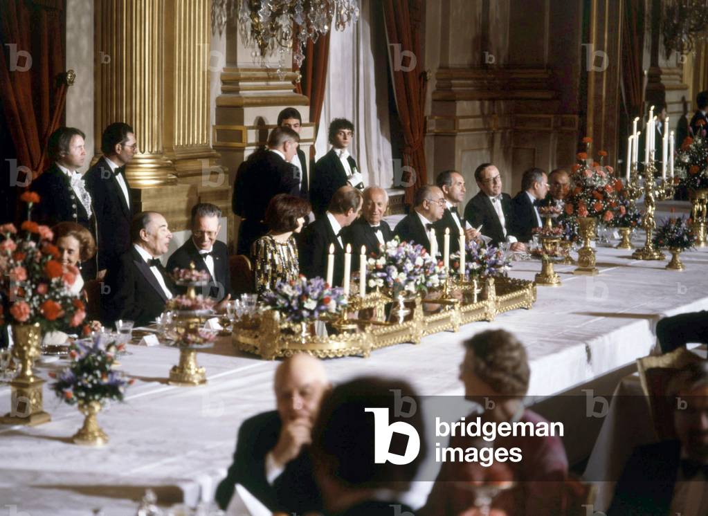 Francois Mitterrand during a diner given by King  Baudouin 1st of Belgium and Queen Fabiola in Brussels on October 12, 1983. l-r : Queen Fabiola, Francois Mitterrand, King  Baudouin, Danielle Mitterrand, prince Albert, Gaston Deferre, a Belgian personality, Charles Fiterman (French minister of transport)