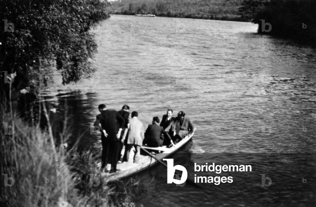 In a boat on the Seine in Porcheville, investigators search for the body of Pierre Loutrel, (1916-1946) known as Pierrot le Fou, public enemy no. 1, leader of the Tractions Avant gang, which fatally injured himself in 1946. (His body will be found in the forest in 1949)