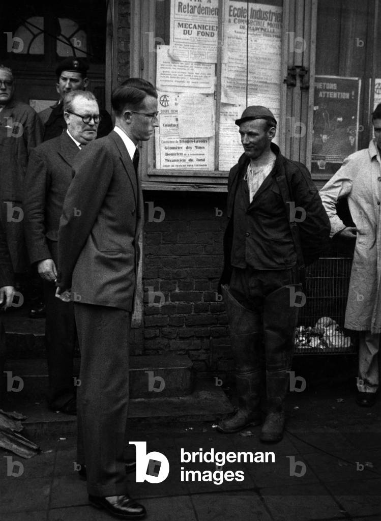King Baudouin 1st of Belgium speaking with a minor after disaster in the mine of Marcinelle (fire, 263 victims) on August 10, 19556