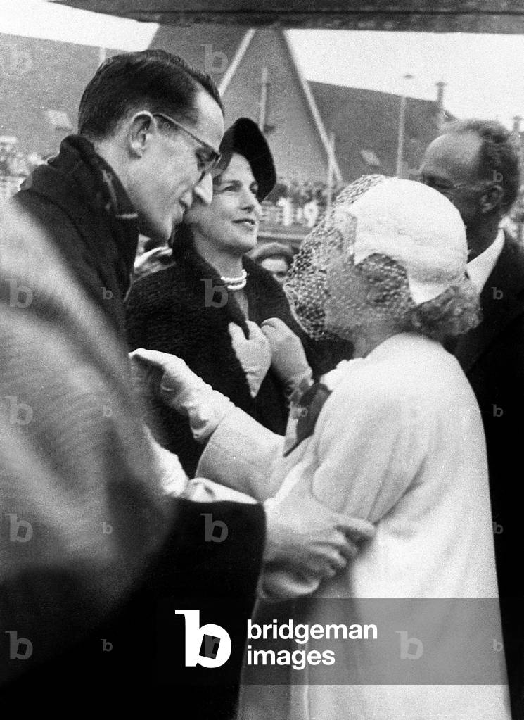 On front row, King  Baudouin 1st of Belgium welcoming his grand-mother Elizabeth former Queen of Belgium (born duchess of Bavaria) on February 2, 1958 . in the 2nd row are his father former King  Leopold III and his stepmother (his father's 2nd wife) Princess Liliane de Rethy (born Mary Lilian Baels)