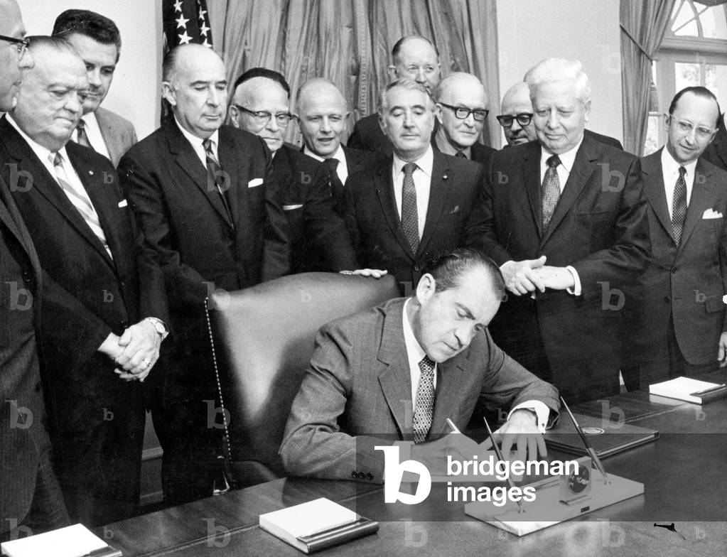 American President Richard Nixon, with members of the congress and the cabinet, signing decree to fight crime in Washington June 04, 1970