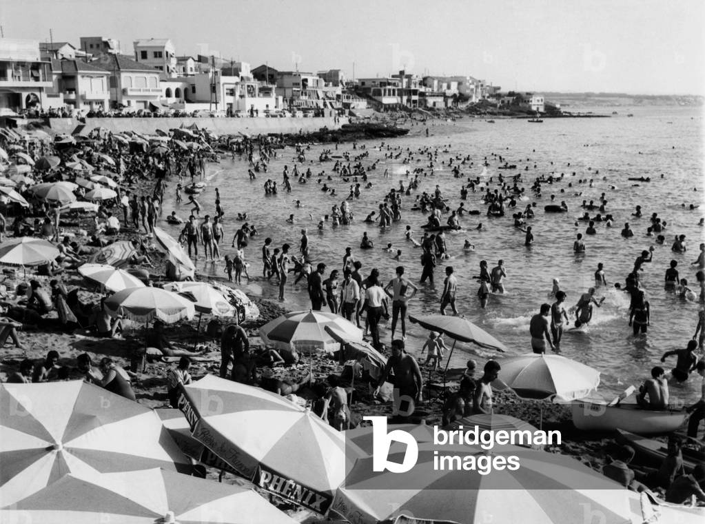 Despite the increase of murderour attemps, life as normal at La Madrague beach. Algiers, Algeria, August 1960.