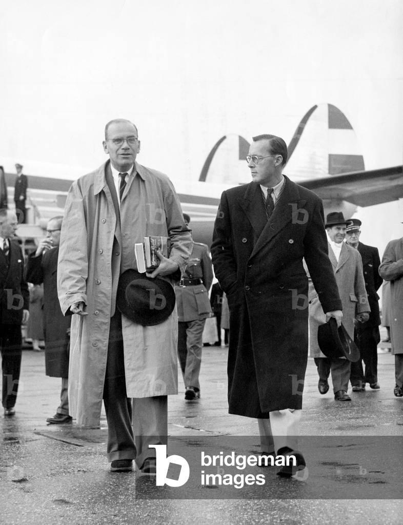 prince Bernhard of Holland (r) arriving from New York with Dr von Graaf, his private secretary, at Schiphol airport November 02, 1956