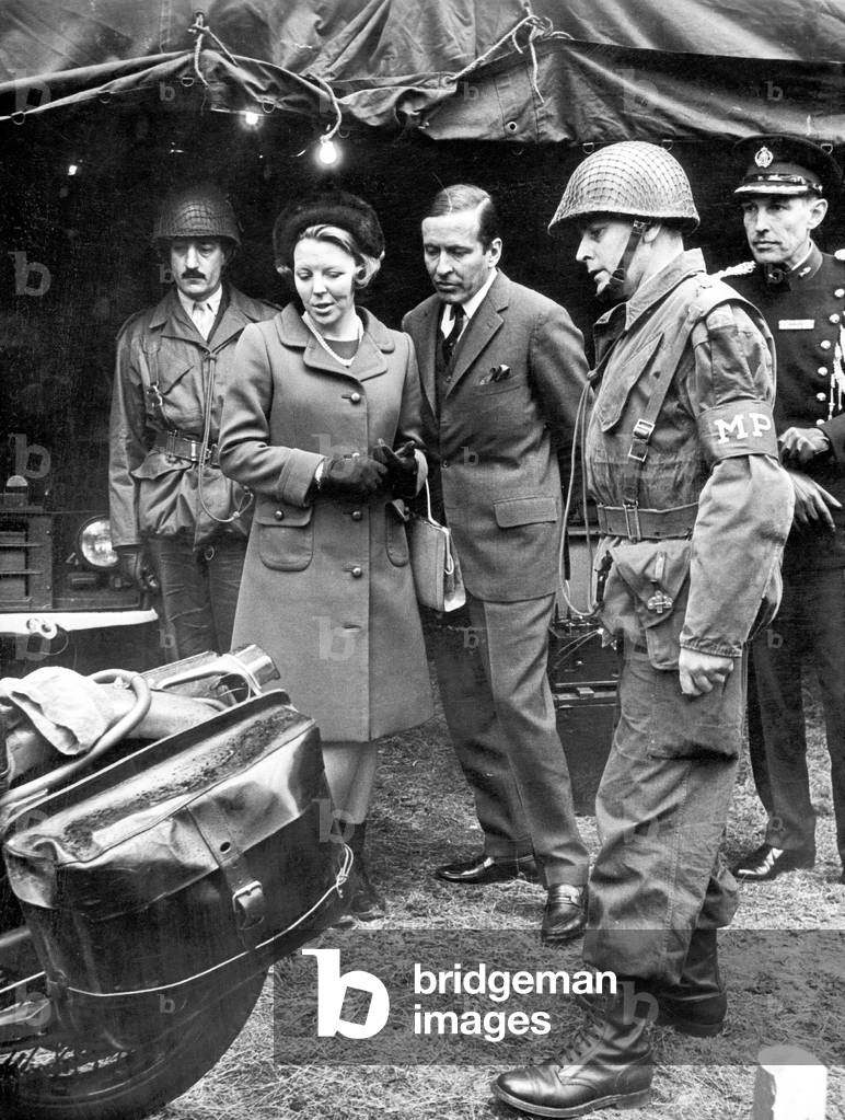 Princess Beatrix of the Netherlands and husband prince Claus reviewing 11th squadron in Garderen woods April 03, 1968