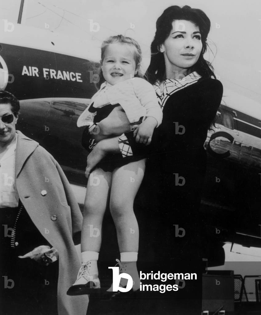 Singer Juliette Greco arrives to Paris with her daughter Laurence-Marie, May 3, 1957