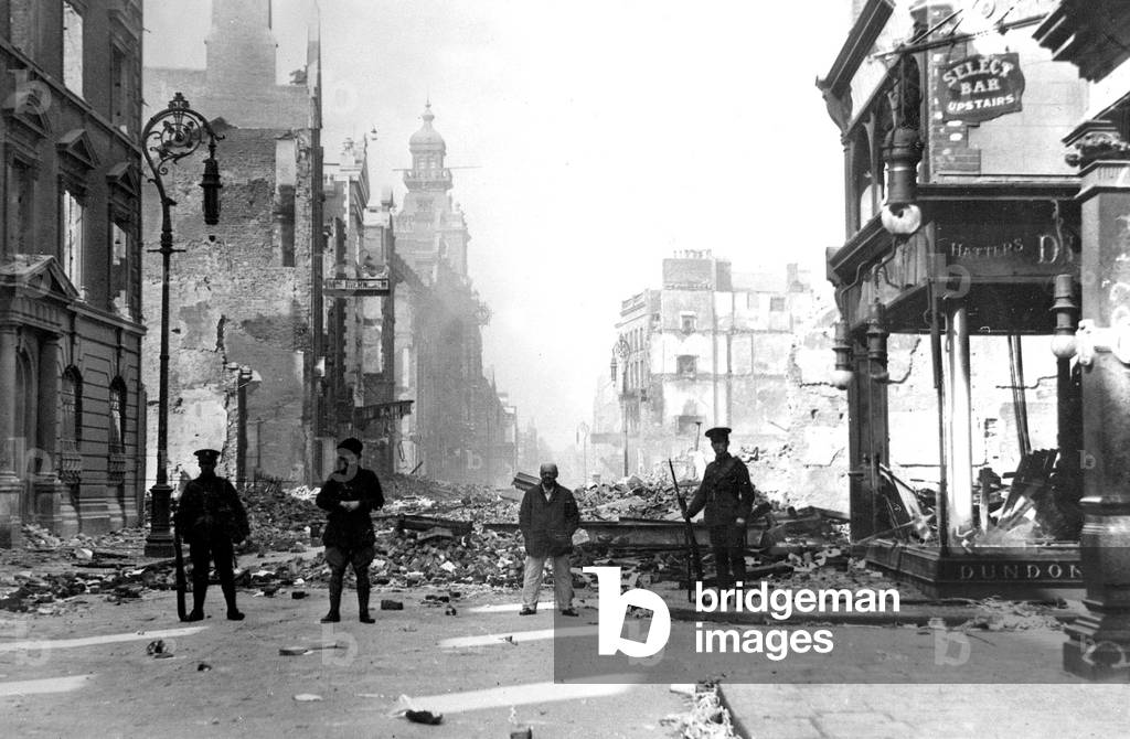 English soldiers in street of Dublin after fighting with rebels (who want independance) 1920