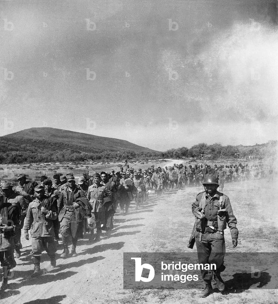 Tunisia campaign in May 1943 : German prisoners at Fahs bridge driven by tunisians colonial infantrymen