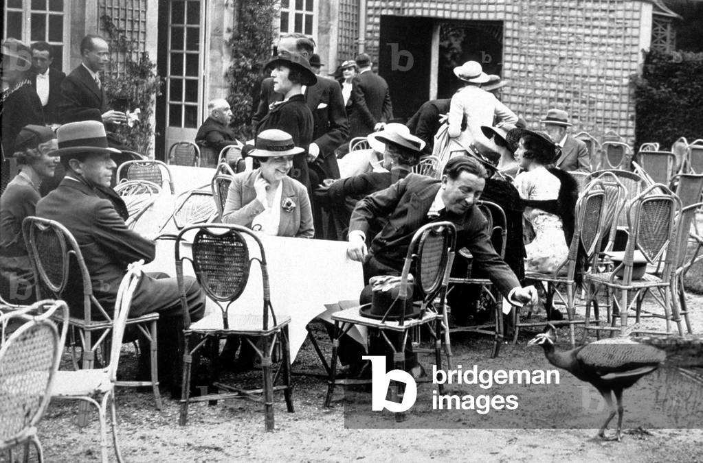 French writers Pierre Benoit (r) et Francis de Croisset (l) at Garden Party given by French Academy in Chantilly June 20, 1935 paon peacock