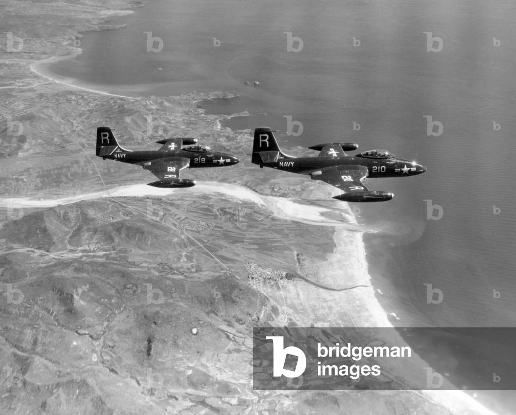 Two Banshee jet fighters from the carrier Essex in search of targets in the North Korean sector. Korea, 1951