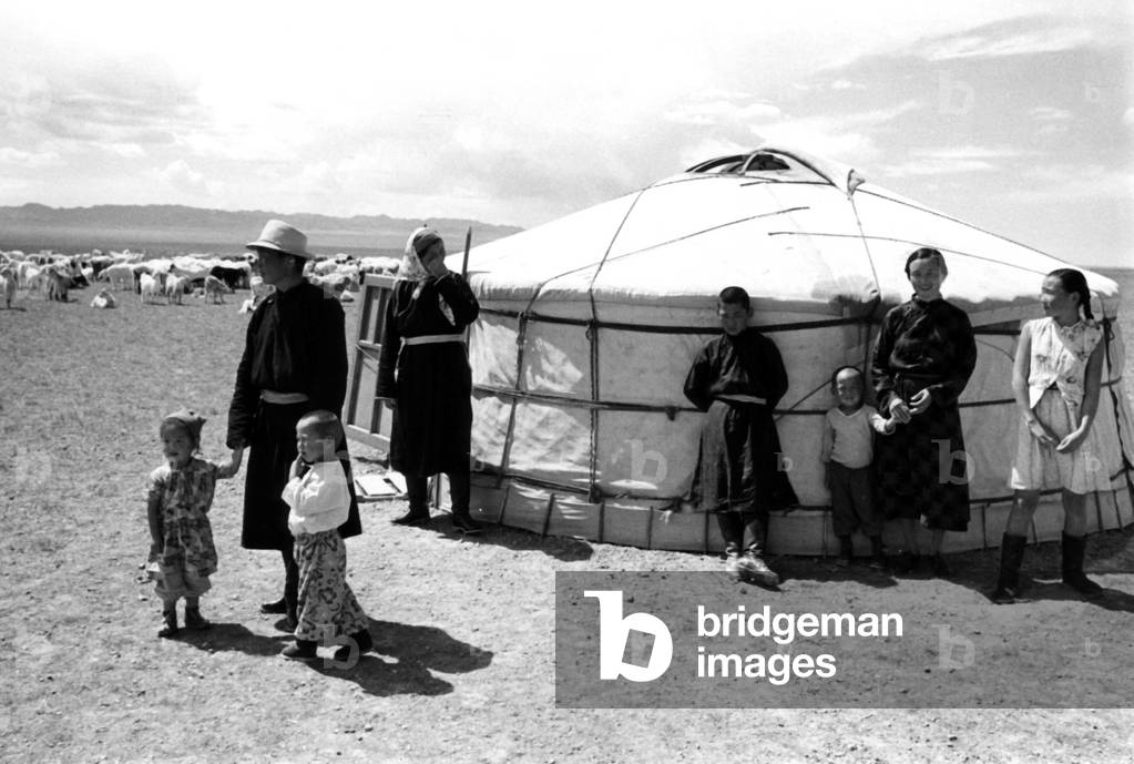 Peasant family living in a yurt in the Tuya farm in South Gobi, Mongolia in December 1964 (the man is a goat shepherd, and he lives with his five children, his daughter and his wife)