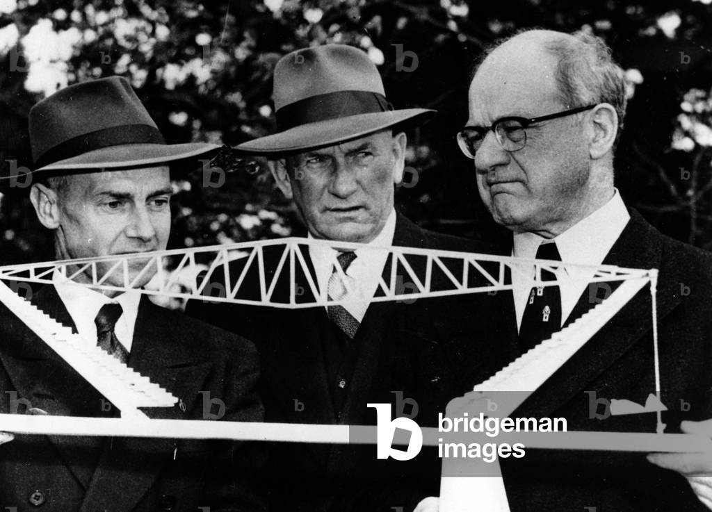Preparation for the Olympic Games in Melbourne Mr Avery Brundage, President of the International Olympic Committee, went to Melbourne to carry out the work in progress for the next Games Here Mr Brundage on the right examines the model of the Olympic pool, in the center the General Bridgeford Chief Executive of the Games on the left the engineer Mr Len Frazer on the 14th April 1955