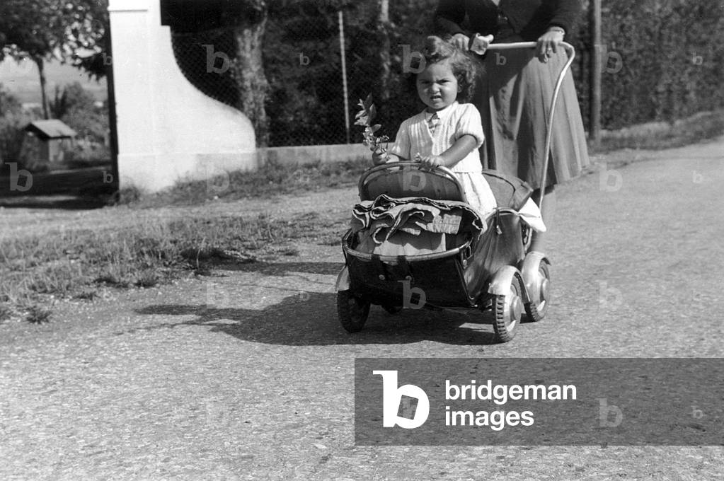 Little girl in a pushchair / pram, 1947