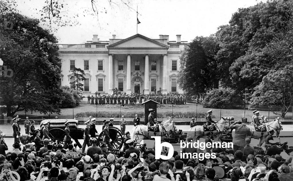 Coffin of President Franklin Delano Roosevelt (who died April 12, 1945) passing by the White House in Washington with guard of honor April 14, 1945 (after funeral service which took place in the East Room at the White House)
