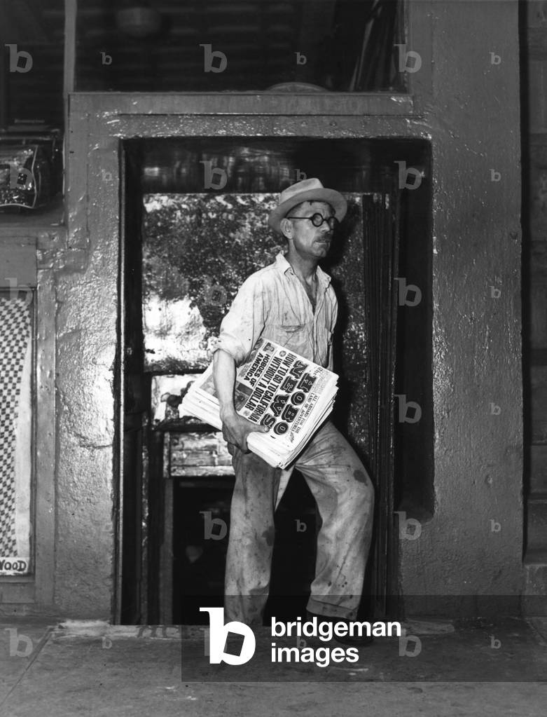 Otis Rodgers holding paper Hobo News 1937