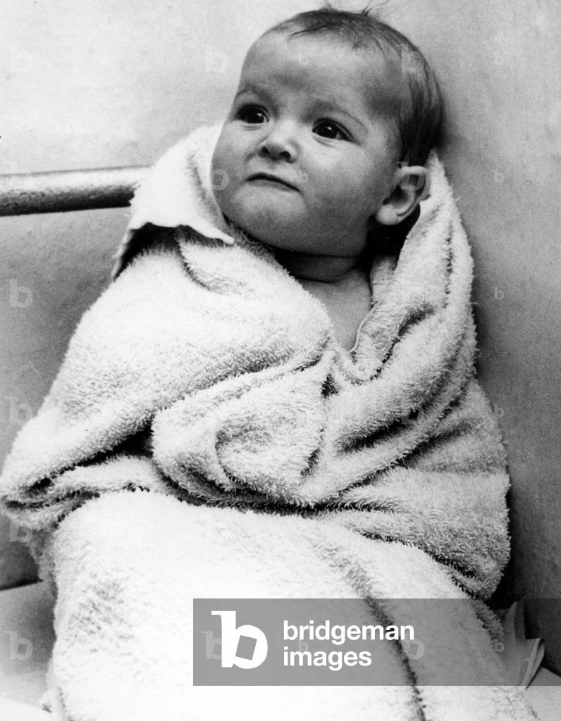Baby in towel after the bath decembre 9, 1960