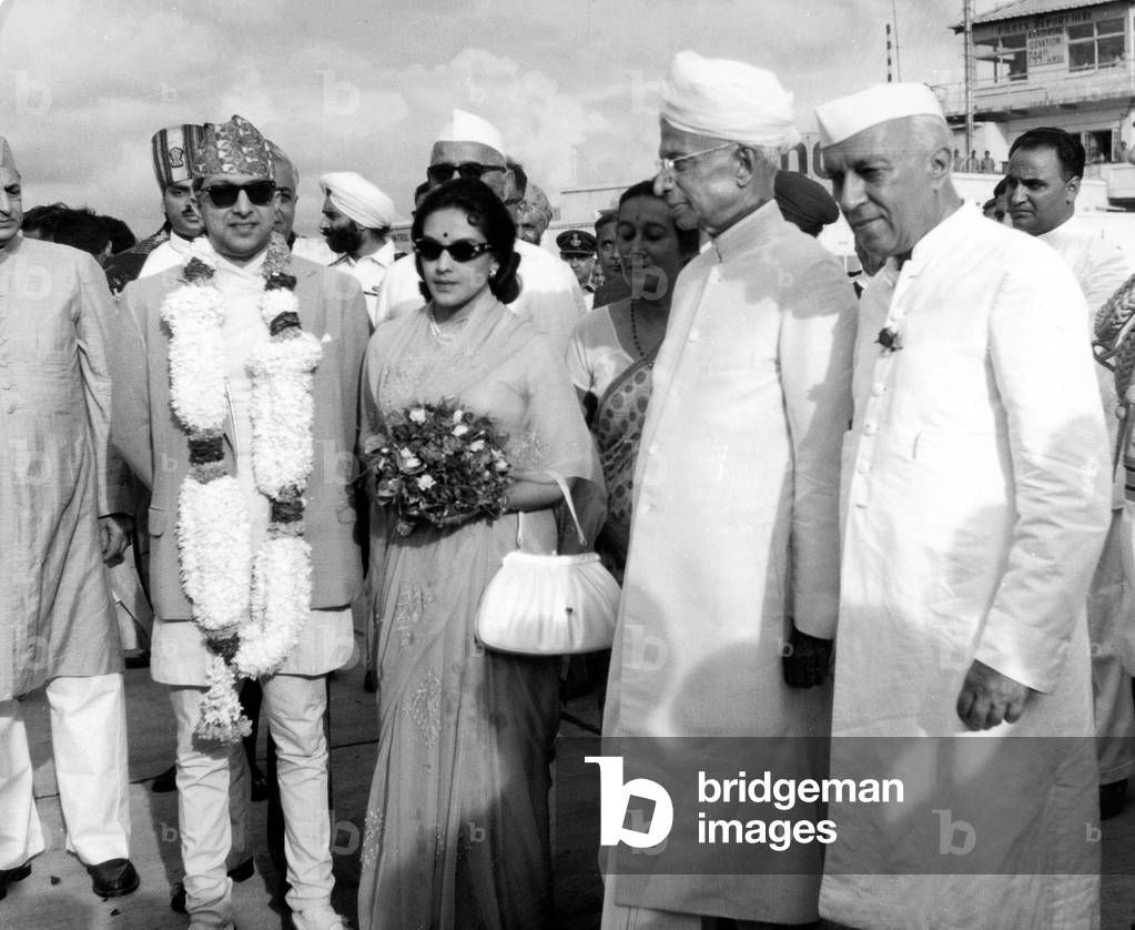 king Mahendra and Queen Ratna of Nepal (center) greeted in India by President Radhkrishnan and Prime Minister Nehru (r) in New Delhi August 27, 1963