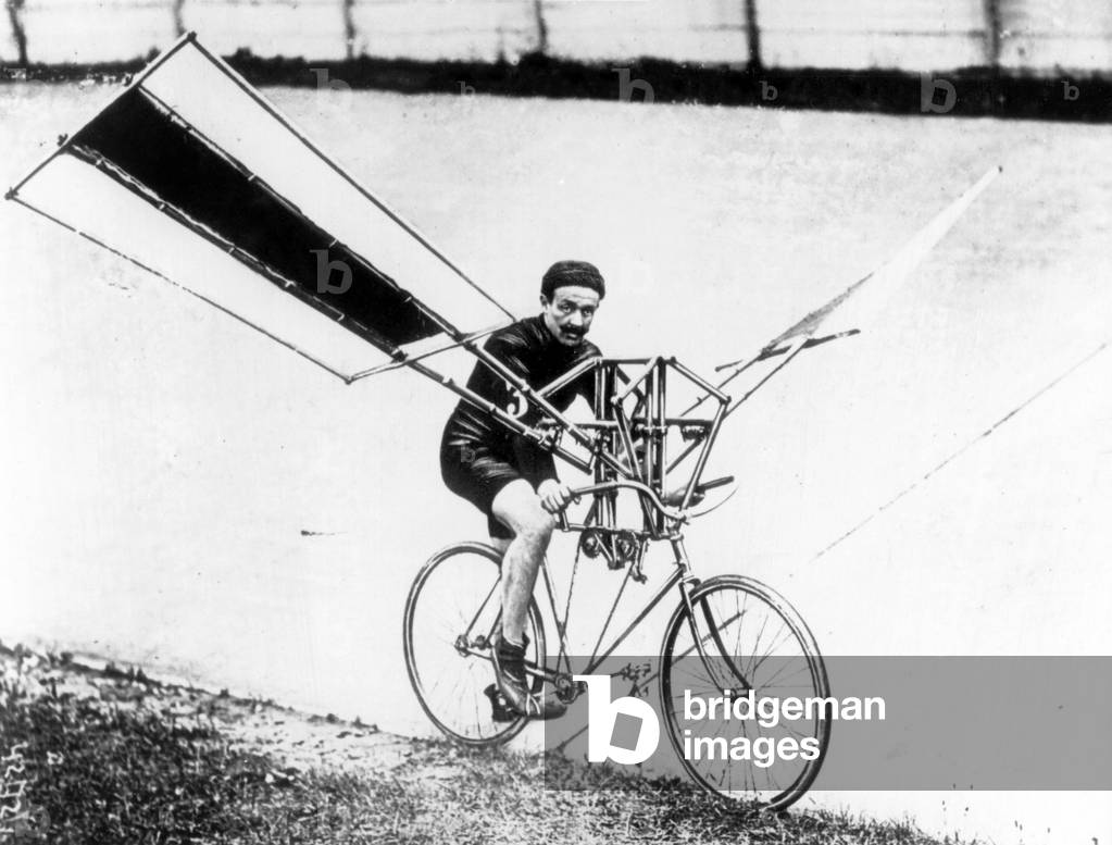 Beginning of the aviation : a man on a flying bike, end of the 19th century (b/w photo)