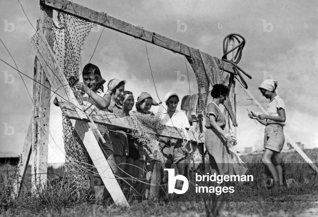 Fishing in Israel in the 50's : here near Sea of Galilee (Kinneret, Tiberias) using of a frame to repair nets