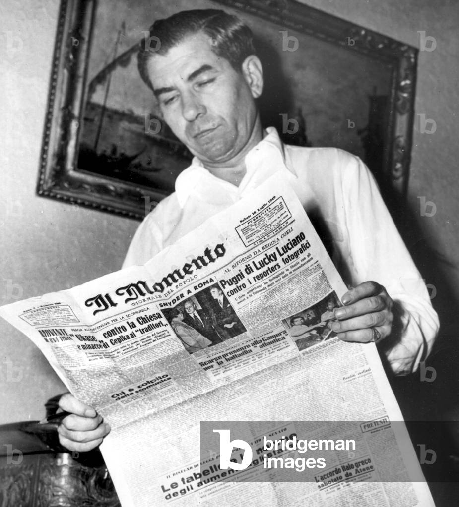 Salvatore Lucania, called Lucky Luciano (1897-1962), gangster of sicilian mafia, here reading Italian paper Il momento, July 16, 1949
