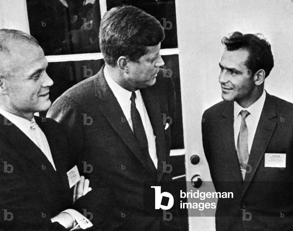 Second cosmonaut Guerman Titov (right) appears with NASA Astronaut John Glenn and President John Kennedy at the White House in 1962 (at time of Mercury project). Titov was in Washington to give his account of the Vostok 2 spaceflight to the Committee on Space Research (COSPAR). The twenty-five-year-old Titov was the youngest person to ever go into space - a record that still stands to this day