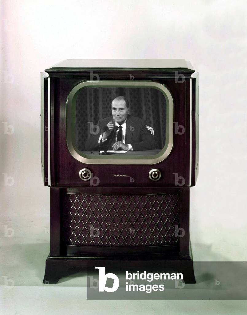 photomontage showing French President Francois Mitterrand at television (Motorola TV) during a press conference
