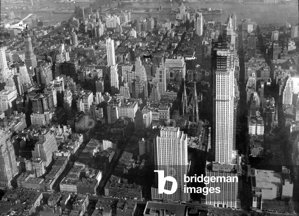 An aerial view of New York showing the Rockefeller Center Building and the RKO building 1932