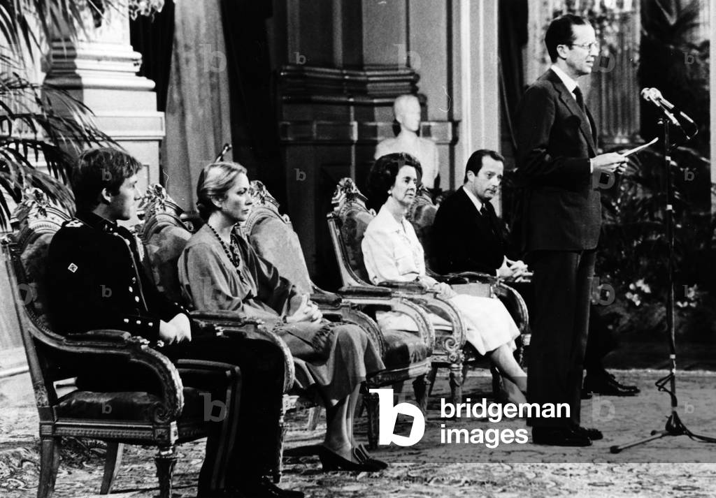 King of Belgians Baudouin 1st making his Christmas speech under look of l-r : prince Philippe (future king), Princess Paola (future queen), Queen Fabiola and prince of Liege Albert (future King  Albert II) December 24, 1979