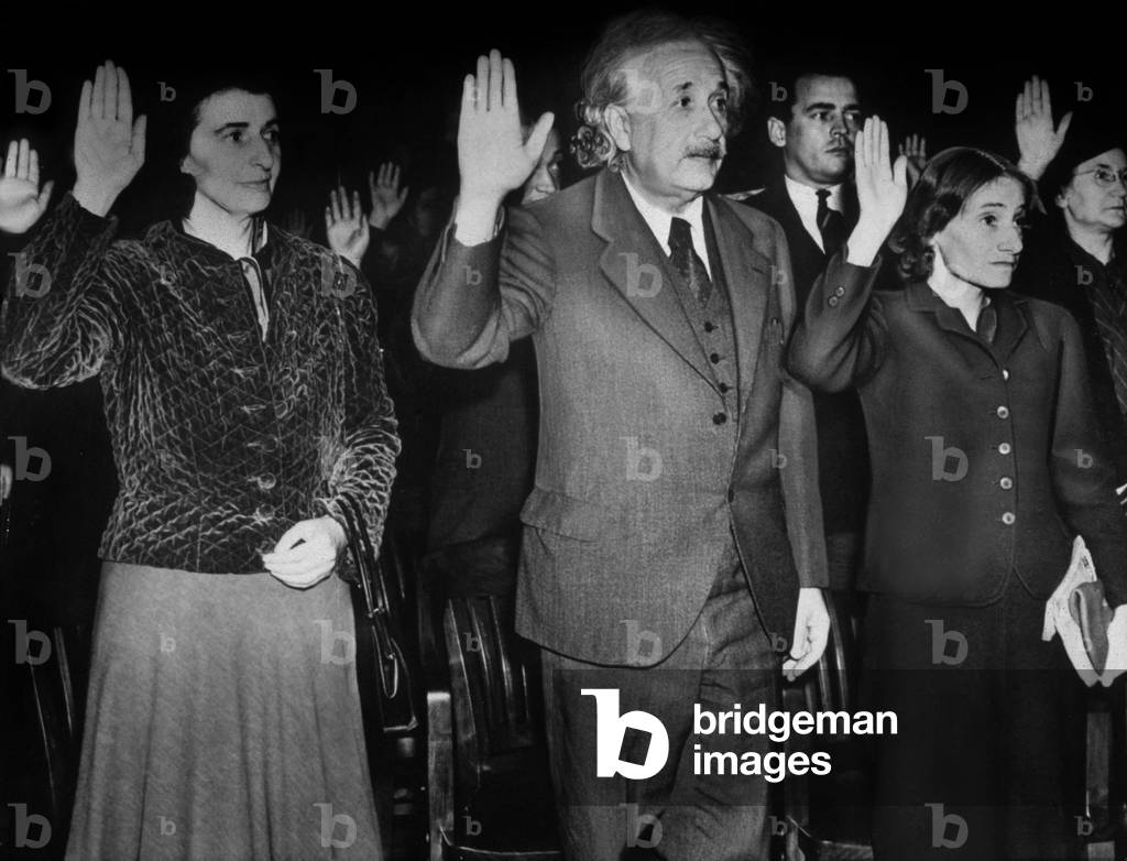 Albert Einstein pledging allegiance to become an American citizen with his secretary Helen Dukas and his step daughter Margot, 1940 (b/w photo)
