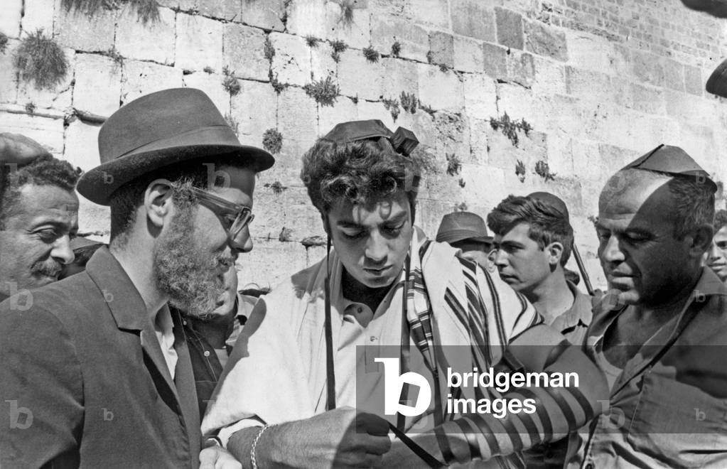 French Singer Enrico Macias in front of the Wailing Wall in Jerusalem July 1967 to sing for Israeli soldiers