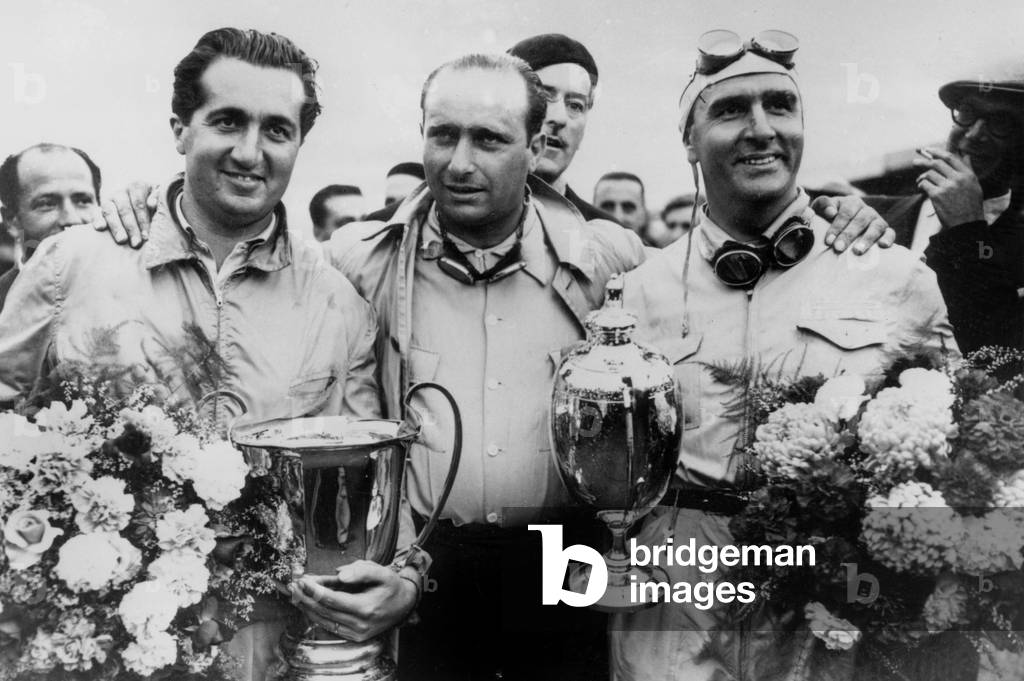 l-r : racing drivers Alberto Ascari, Juan Manuel Fangio and Emilio Giuseppe Farina with their trophies, 50's