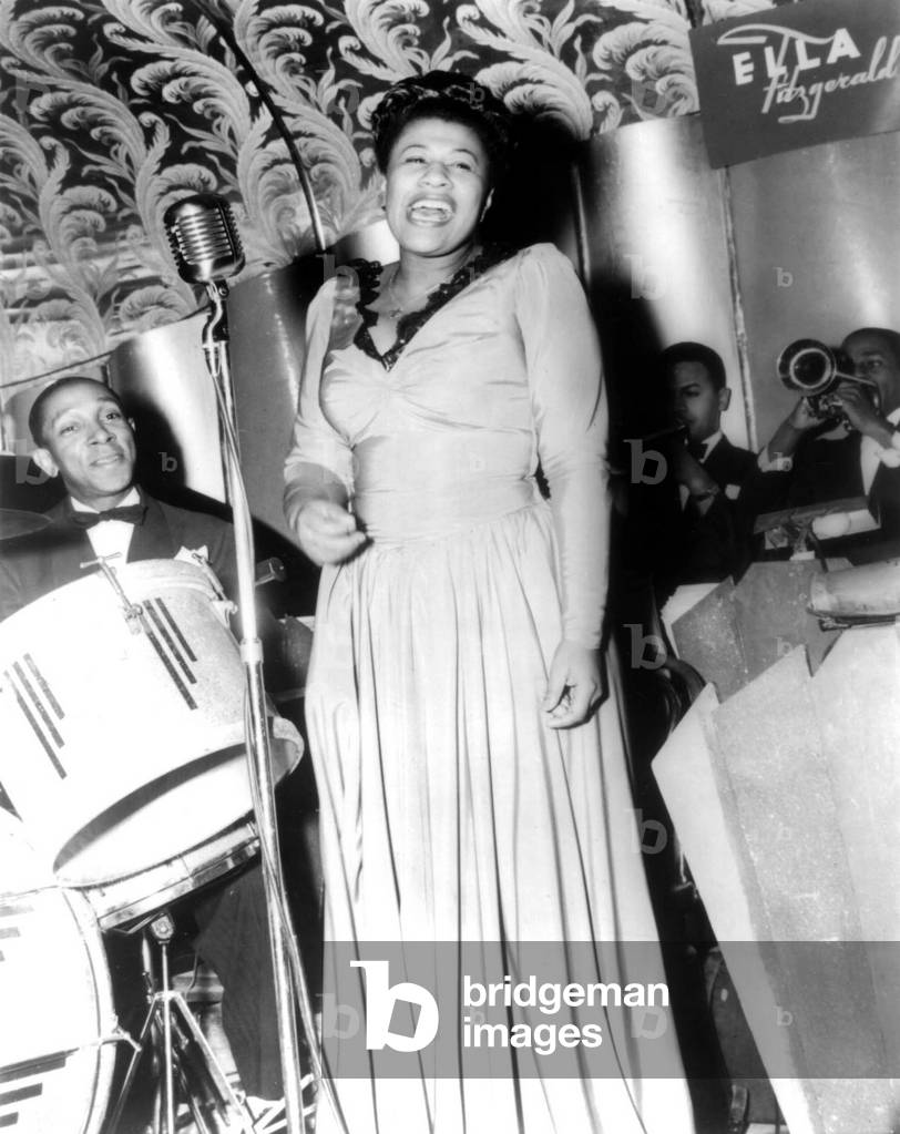 Ella Fitzgerald (1917-1996) American jazz Singer here with drummer Bill Beason and trumpeters Dick Vance and Irving Randolph, at the Savoy Ballroom in New York 1941