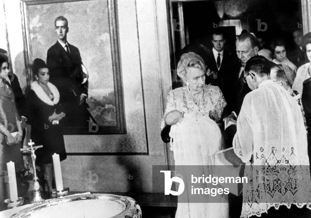 Former Queen of Spain Victoria Eugenia carrying prince Philippe during his christening on her side are count of Barcelona prince Juan Carlos