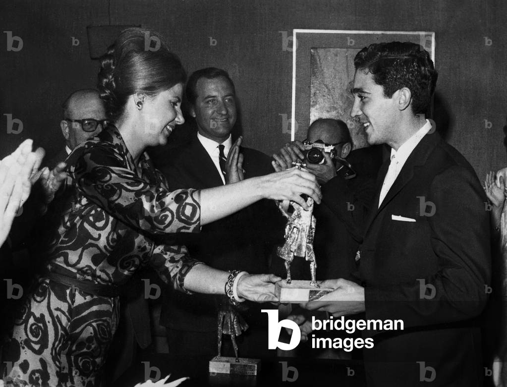 Maria del Rosari Cayetana FitzJames-Stuart, 18th Duchess of Alba de Tormes giving trophy for best toreador 1963 to Paco Camino on May 17, 1964 in Mayte club in Madrid