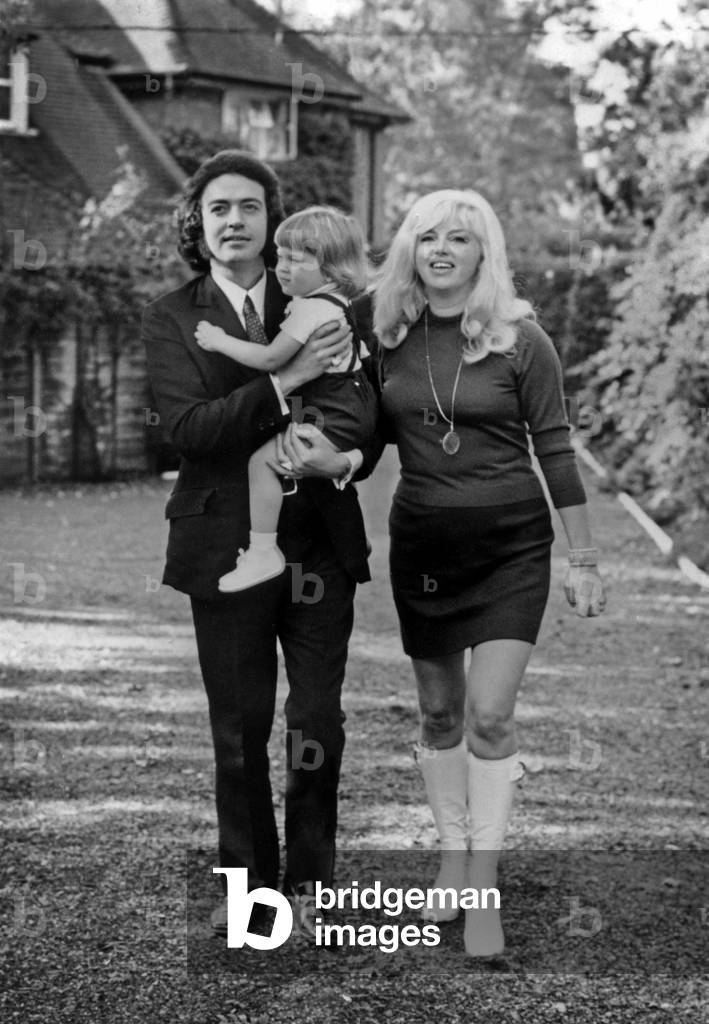 Diana Dors with her husband Alan Lake holding their son Jason, 1971 (b/w photo)