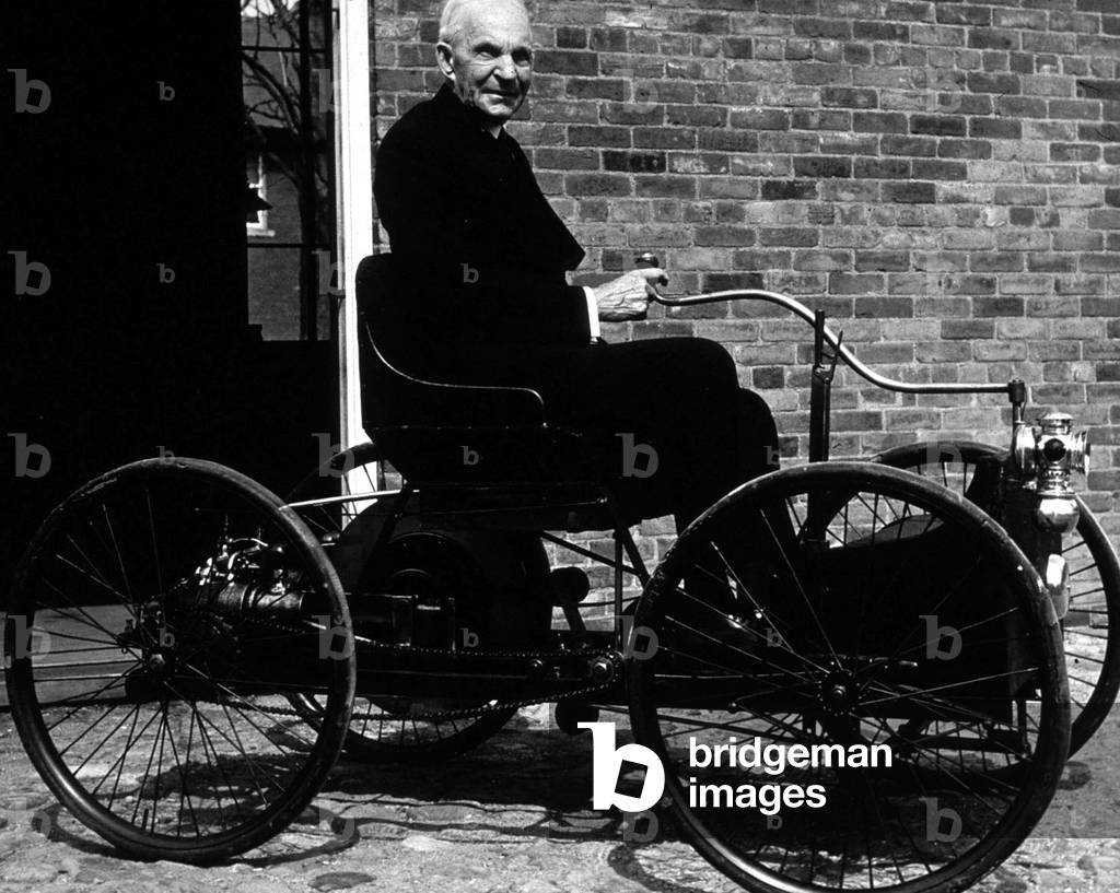 Henry Ford (1863-1947) in his first car Quadricyle built in 1896
