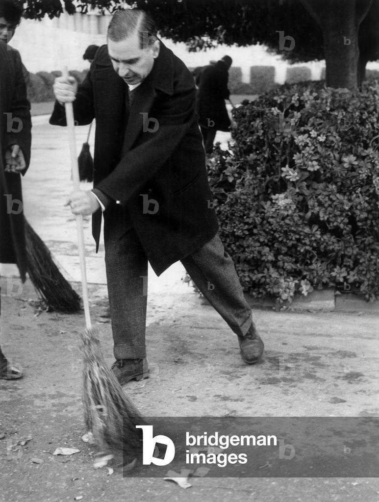 Georges Plytas the mayor of Athenes broom in hand following the strike of municipal employees the mayor reacted and travels the neighborhoods of the city at the head of a group of volunteers on February 4, 1966
