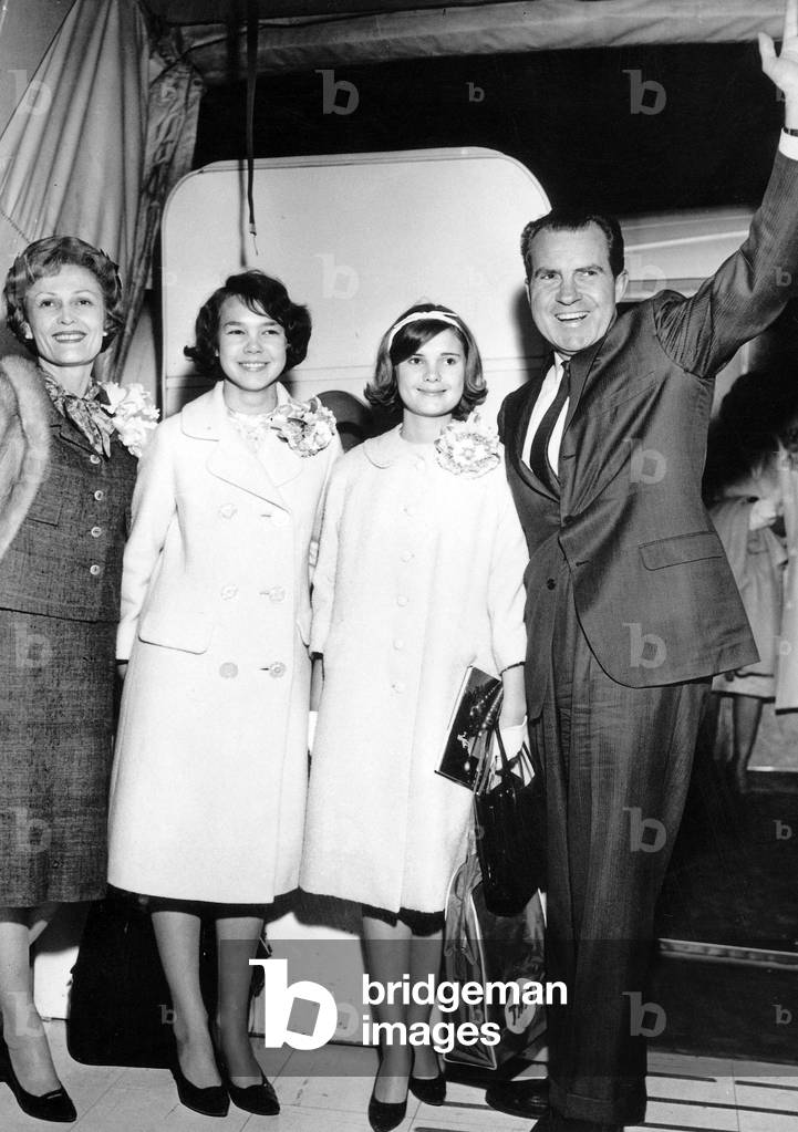Richard Nixon shown with his wife Patricia Thelma Nixon and their daugthers Tricia (Left) and Julie (right) waves farewell before boarding a TWA starstream to Lisbon starting point for an European tour January 18, 1963