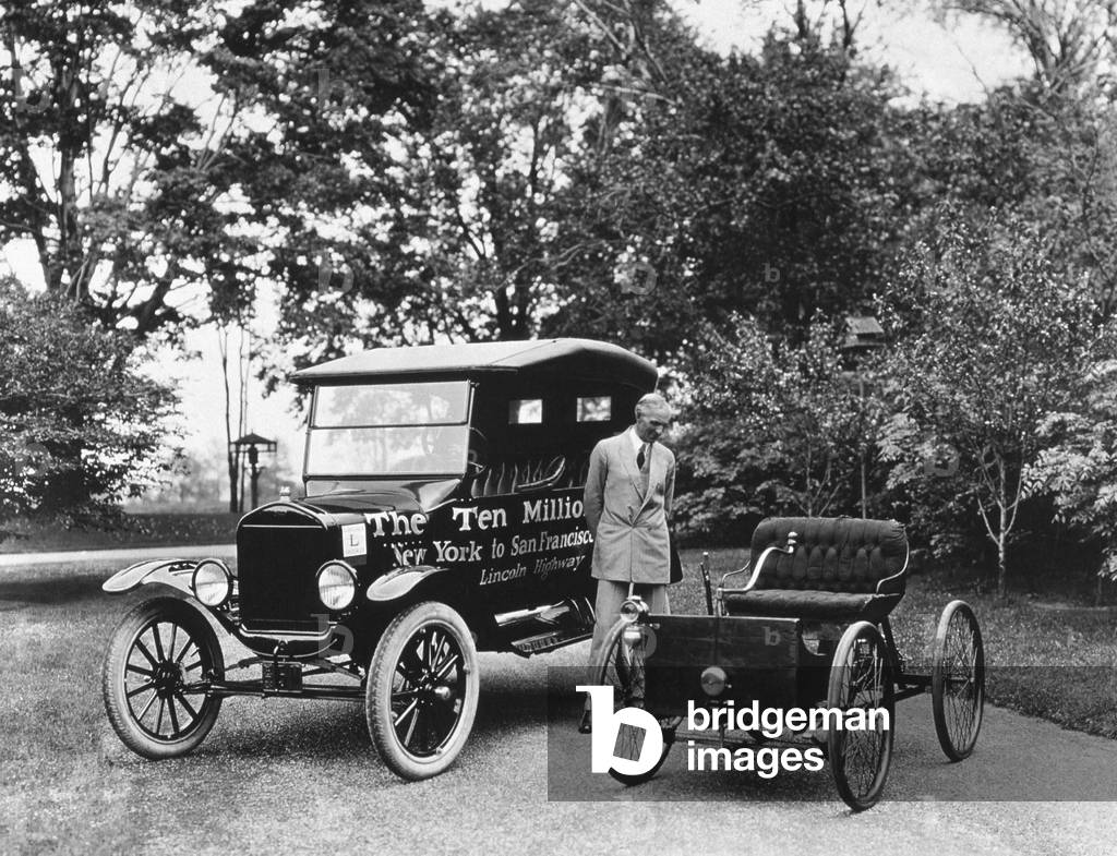 Henry Ford (1863-1947) American industrialist pioneer of American car industry here near a Ford T (ten million built) and looking his 1st car, 1924