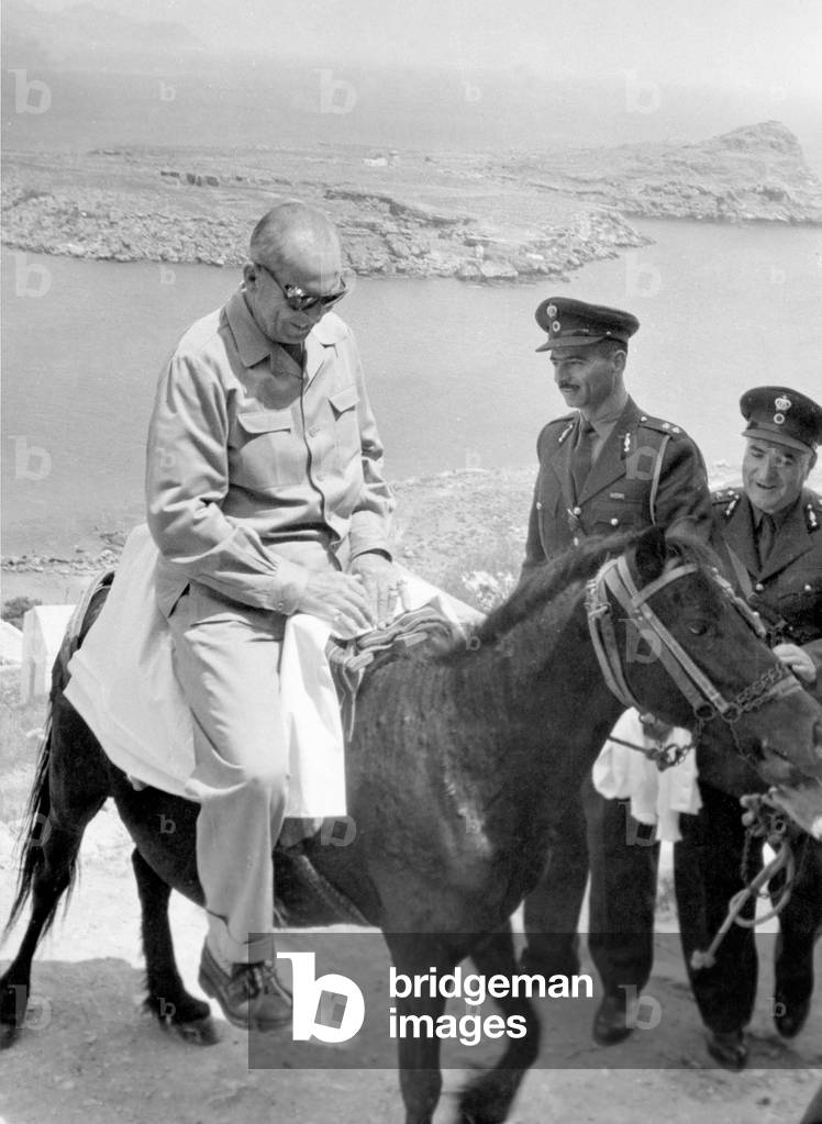 king Paul 1st of Greece riding a female mule during visit of the greek royal family in Rhodes islands April 02, 1960