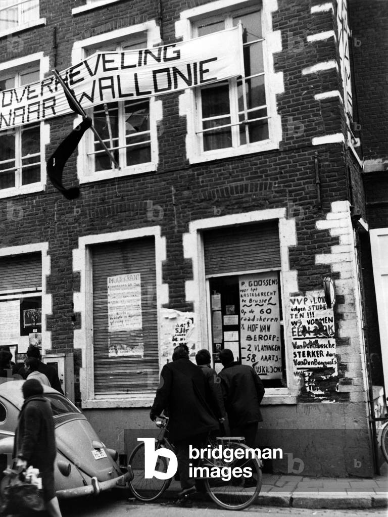 At time of linguistic dispute in Catholic University of Leuven in Belgium between French-speaking Belgians and Dutch-speaking Belgians : black flag on the facade of place of flemish students January 1968