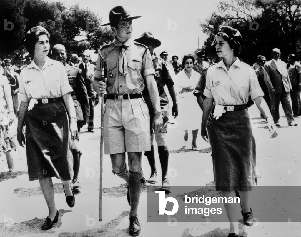 Princess Sophia of Greece and her sister Princess Irene of Greece, with their brother Constantin (future King  Constantin II of Greece) during scout ceremony June 19, 1959