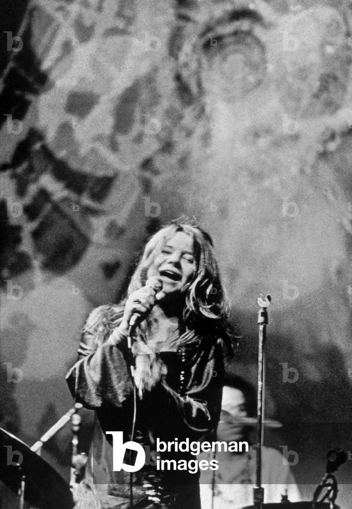 Singer Janis Joplin on stage, late 1960s (b/w photo)