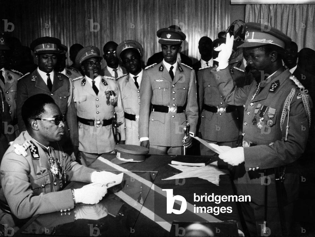 Colonel Leonard Mulamba, first minister, taking the oath opposite General Joseph Desire Mobutu, President of Congo Kinshasa, on December 10, 1965