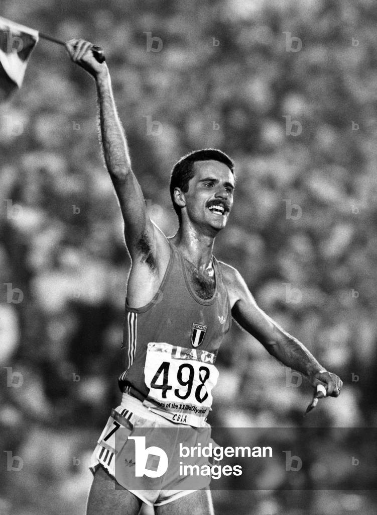 Italian athlete Alberto Cova wins 10,000 m at the 1984 Summer Olympics in Los Angeles here after winning Memorial Coliseum in August 1984