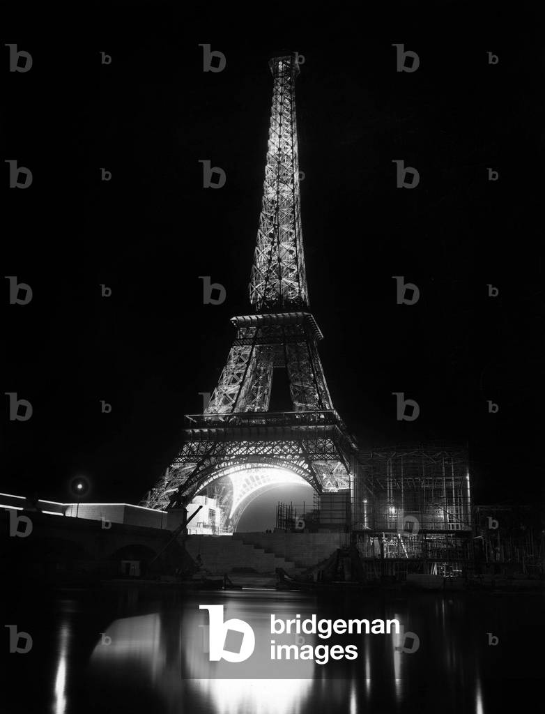 The Eiffel Tower by night at time of set-up of wrold fair in Paris, 1937
