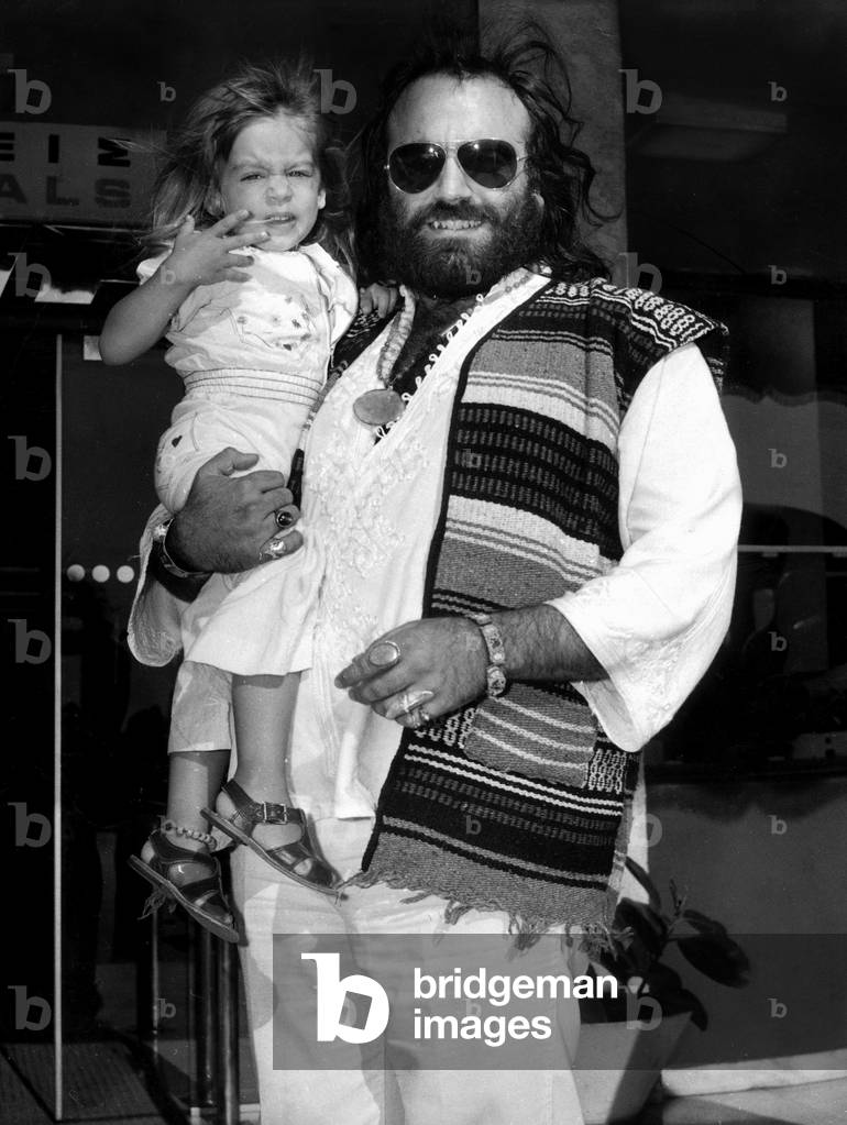 Singer Demis Roussos with his daughter Emily at Athens airport September 14, 1973