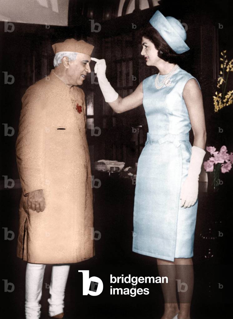 Jackie Kennedy putting some tilak (red paste hindu mark) on the forehead of Nehru March 1962 colourized document